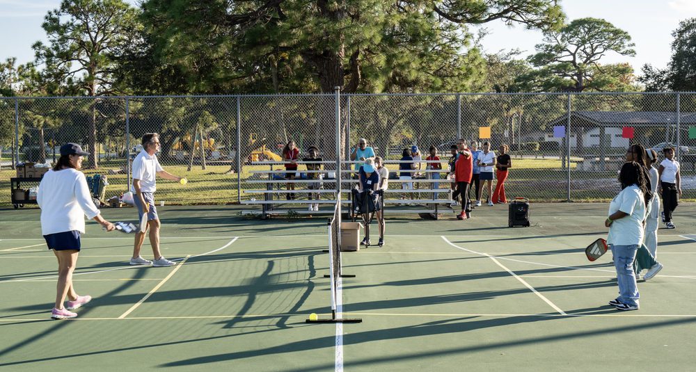 A wide view of several skill stations running side by side across the courts.